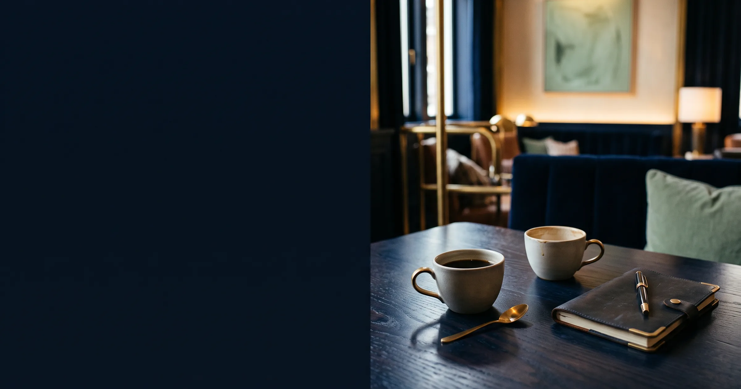 Two coffees and leather notebook on a navy hotel meeting table